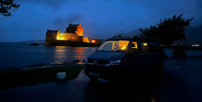 Hamish campervan parked outside a scottish castle